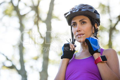 Female athletic wearing bicycle helmet