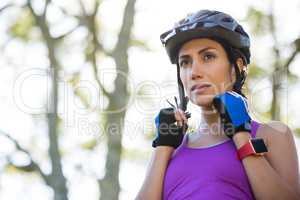 Female athletic wearing bicycle helmet