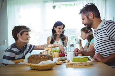 Happy family having breakfast