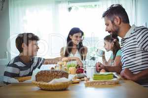 Happy family having breakfast