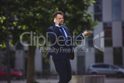 Businessman talking on mobile phone