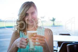 Portrait of smiling woman holding a coffee cup