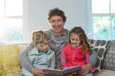 Family reading a book