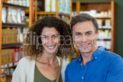 Smiling couple in supermarket