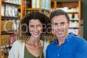 Smiling couple in supermarket