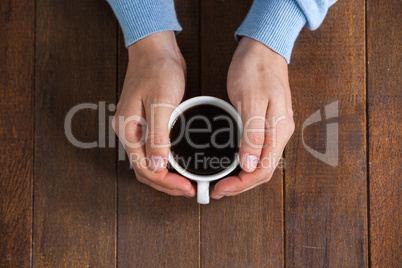 Man holding a cup of coffee