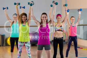 Group of women exercising with dumbbell