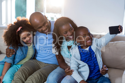 Family taking selfie from mobile phone