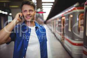 Handsome man talking on mobile phone