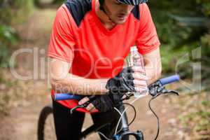 Male cyclist taking break during cycling
