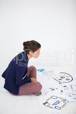 Businesswoman working on icon charts