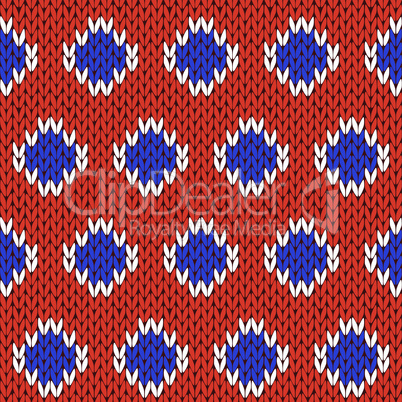 Knitting seamless pattern in blue, white and orange colors