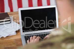 Soldier using a laptop
