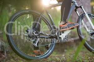 Low section of male biker with mountain bike