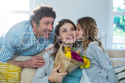 Daughter kissing her mother