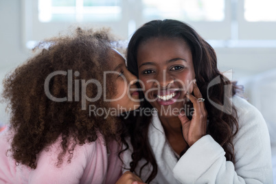 Daughter kissing her mother