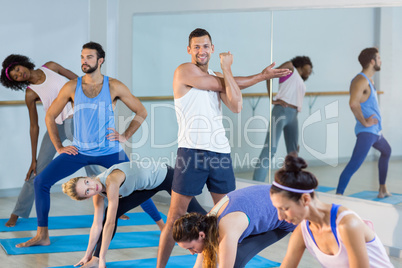 Group of people performing stretching exercise