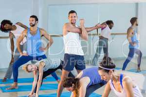 Group of people performing stretching exercise