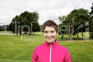 Woman standing in golf course