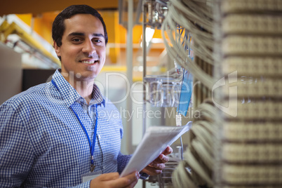 Portrait of technician analyzing server