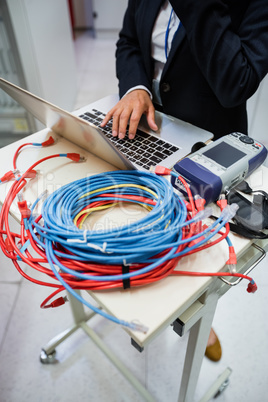 Technician using laptop