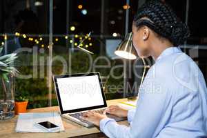 Businesswoman working on laptop