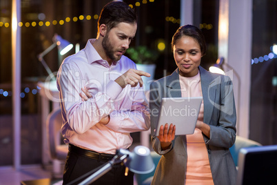 Businesspeople using digital tablet