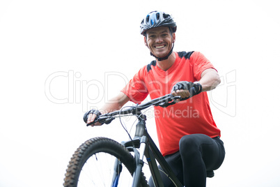 Male cyclist cycling in countryside