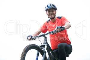 Male cyclist cycling in countryside