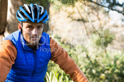 Portrait of male mountain biker in the forest