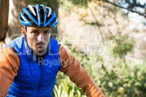 Portrait of male mountain biker in the forest