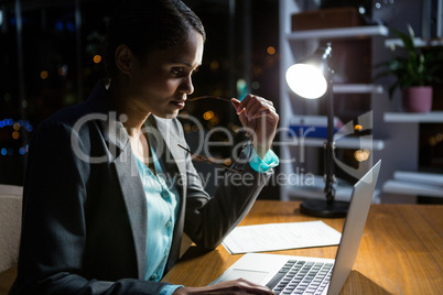 Businesswoman working on laptop