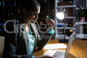 Businesswoman working on laptop