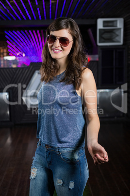 Young woman posing on dance floor