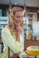 Smiling woman looking at dessert