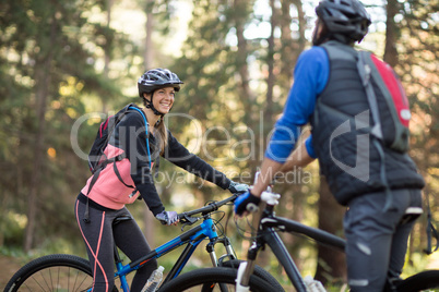 Biker couple smiling and interacting with each other