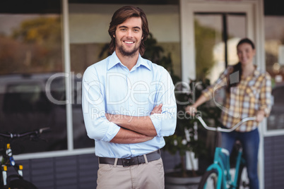 Portrait of man standing with arms crossed