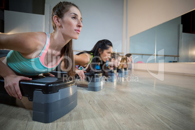 Group of women exercising on aerobic stepper