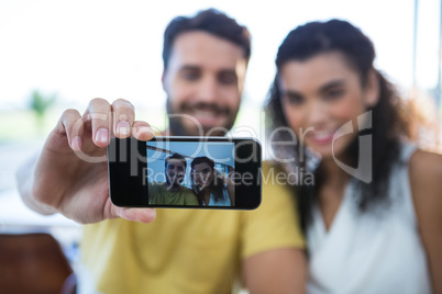 Smiling couple taking a selfie