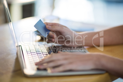 Woman using laptop in cafÃ?Â©