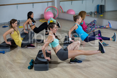 Group of women exercising on aerobic stepper