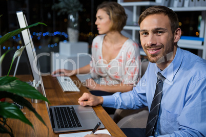 Businesspeople working in office