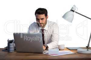 Businessman working on laptop in office