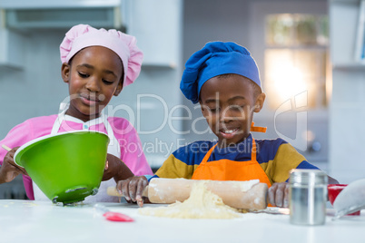 Children preparing cake