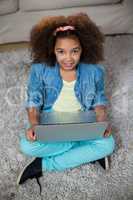 Portrait of girl using laptop