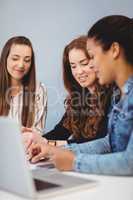 Businesswomen with laptop at desk