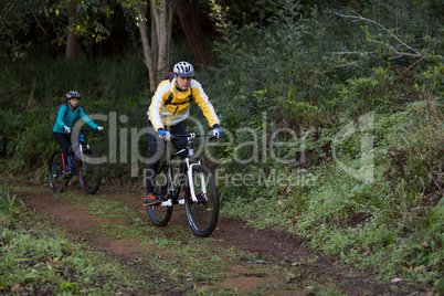 Biker couple cycling in countryside