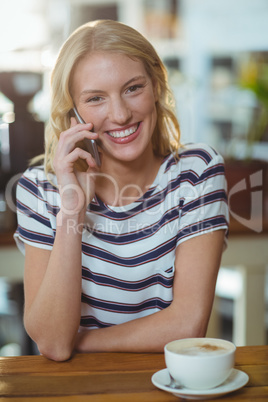 Portrait of woman talking on mobile phone