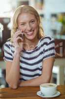 Portrait of woman talking on mobile phone