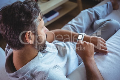 Father using a smart watch